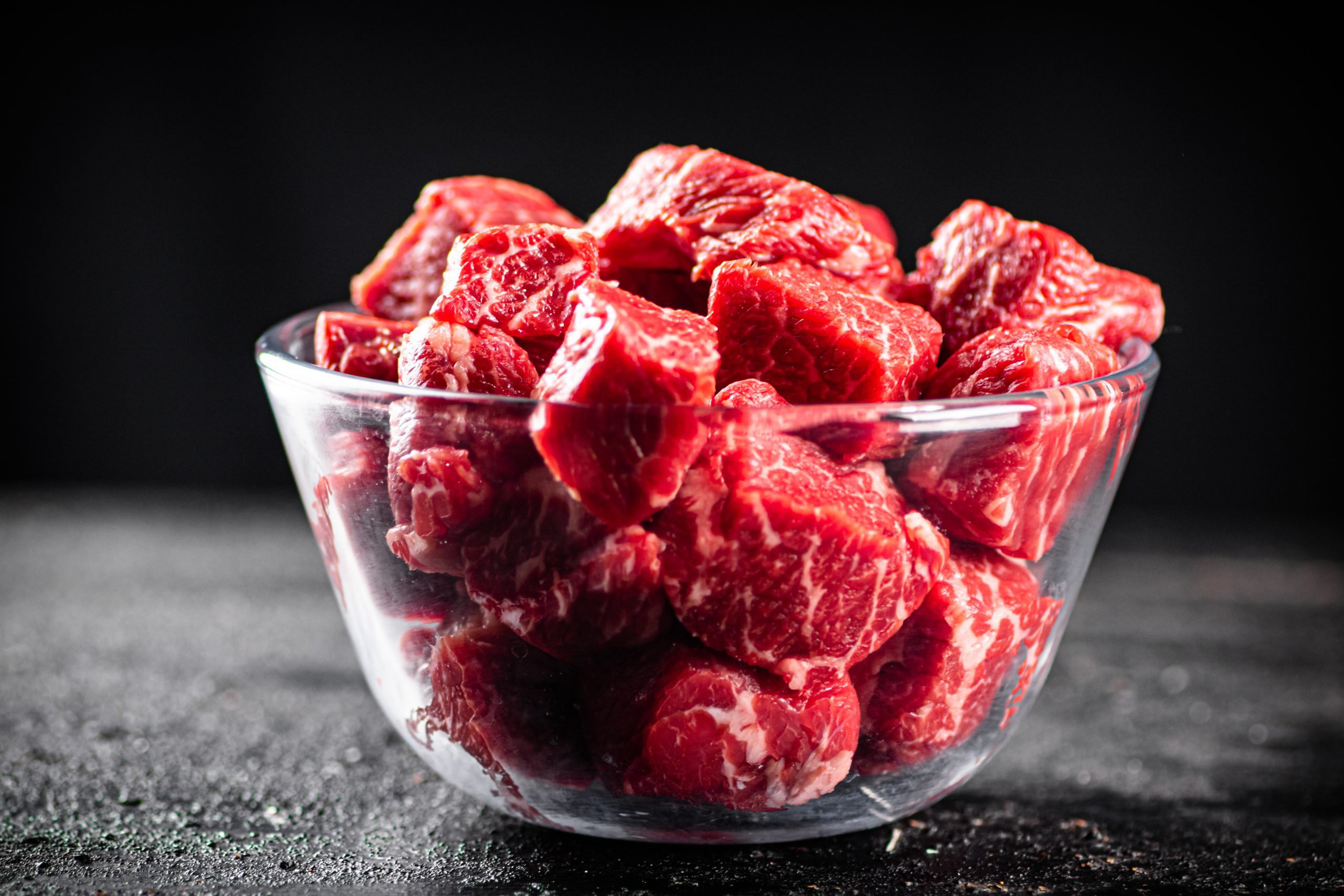 raw-pieces-of-beef-in-a-glass-bowl-2022-01-12-00-42-16-utc-scaled